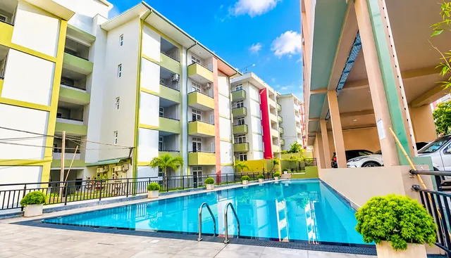 Shared swimming pool surrounded by the apartment buildings